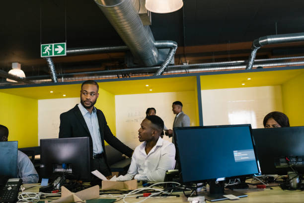 Busy office environment, all eyes turned to office politics happening off screen.