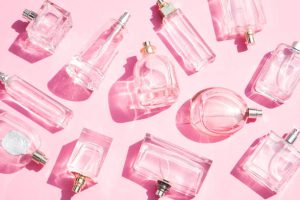 Perfume bottles on pink background