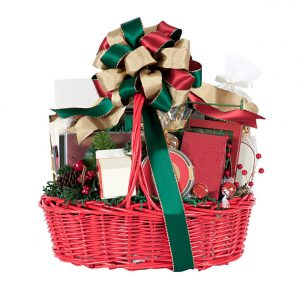 Holiday gift basket filled with a variety of goodies. Isolated on white.