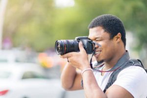 Young male event photographer