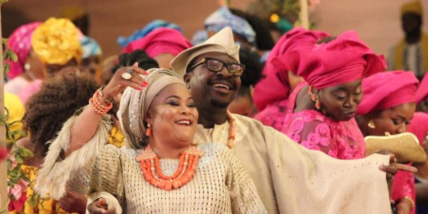 Nigerian couple partying at an Owambe. A still from 'The Wedding Party'