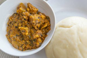 Nigerian Pounded Yam served with Spicy Bitter leaf soup at home