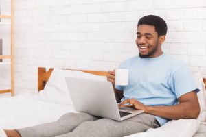 Young man looking at laptop screen