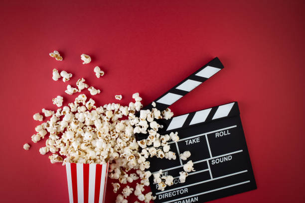 Popcorn and Clapperboard to depict a movie and cinema
