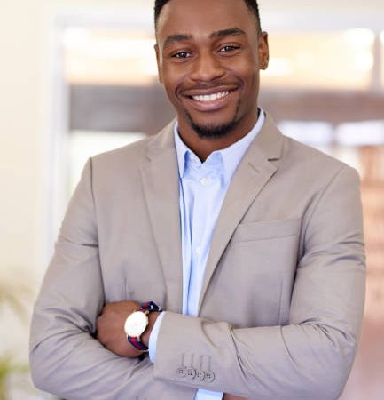 Portrait of a confident young businessman standing in an office