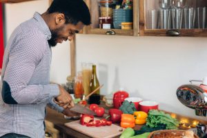 Young man cooking in the kitchen