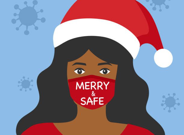 Black woman wearing medical face mask and Santa Claus hat