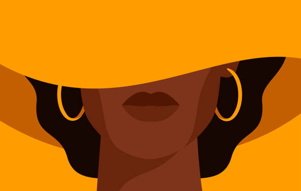 Young African American woman with black curly hair in the yellow hat with a wide brim covering her face.