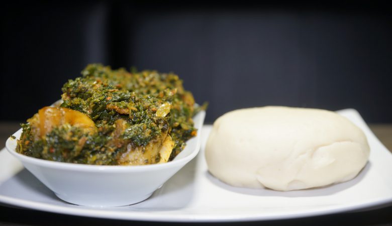 Efo Riro & Fufu served on white plates