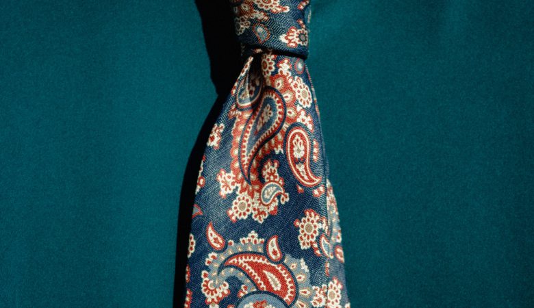 A neck tie with a paisley pattern