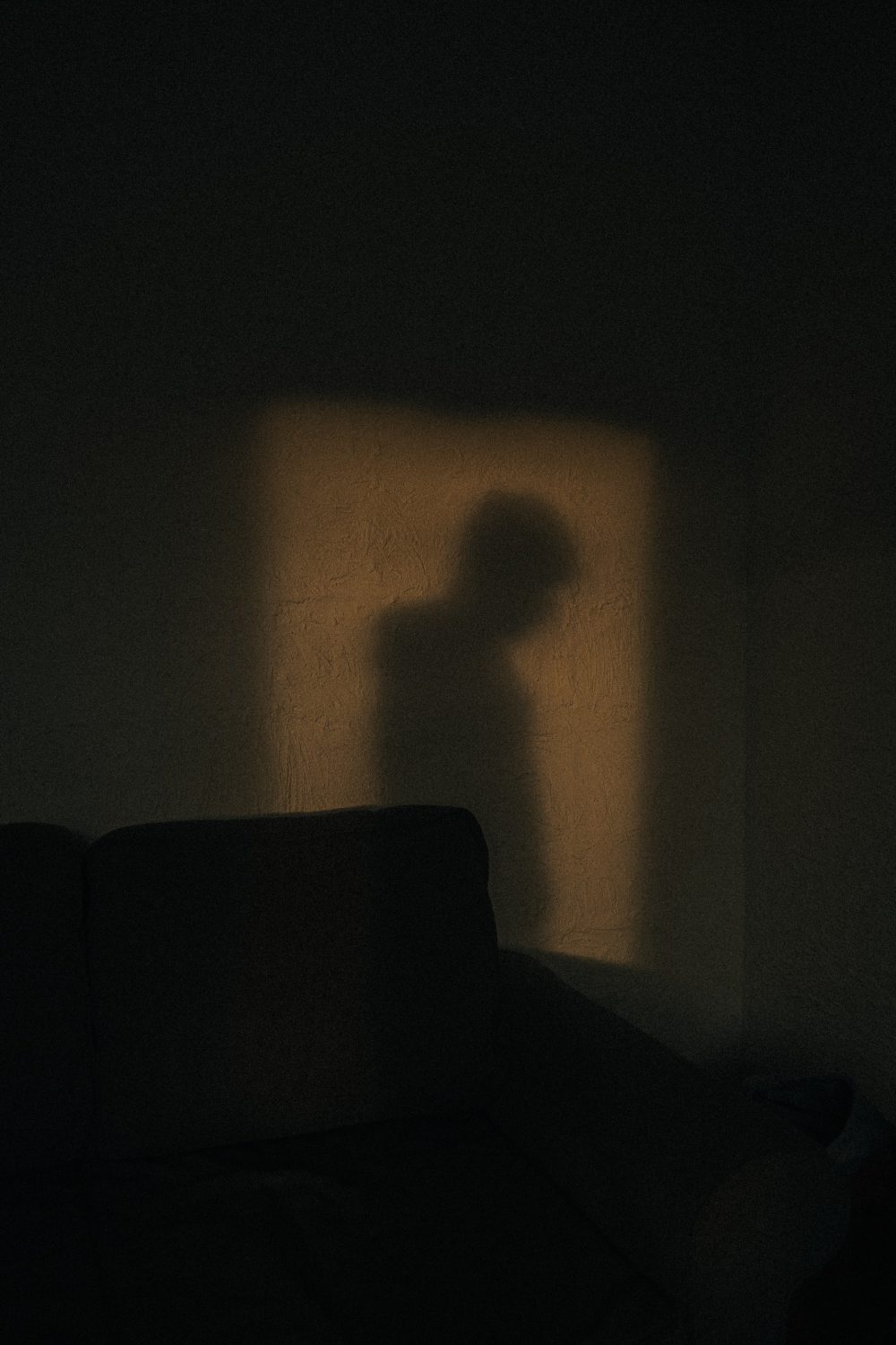 A shadow of a young individual