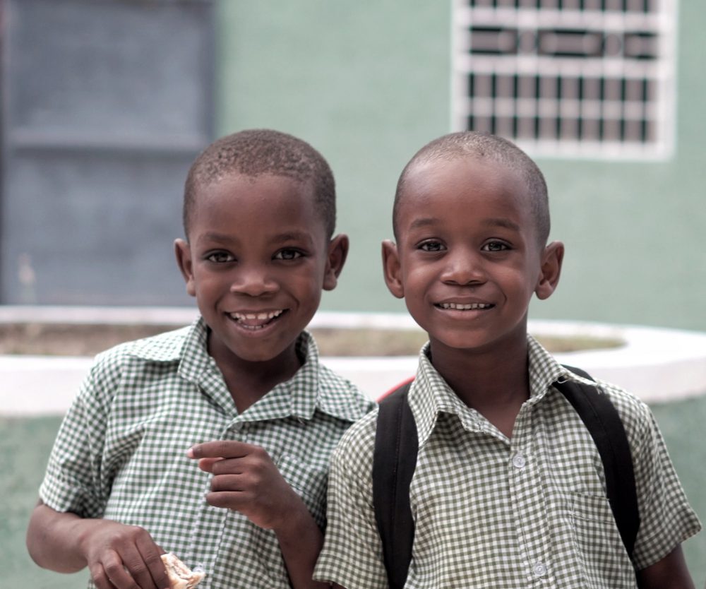 Two young male children smiling