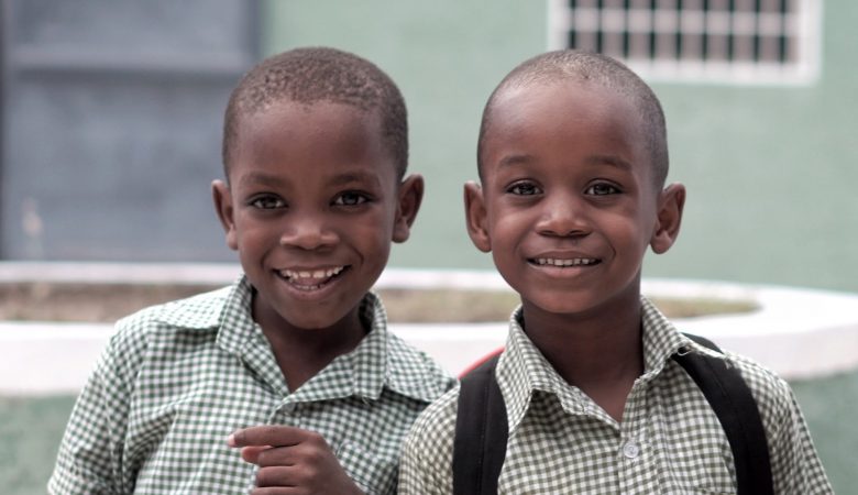 Two young male children smiling